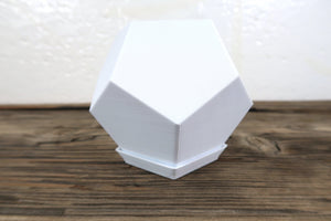 3D Printed 12 sided pot in white that is about 4 inches tall.